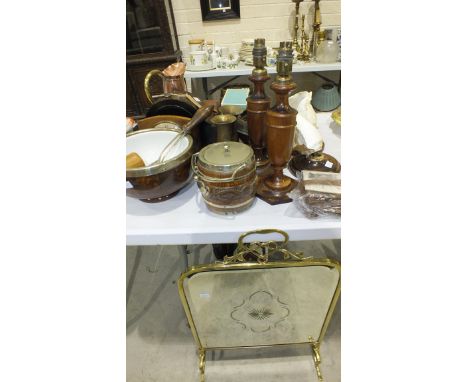 A brass and glass-mirrored fire screen, various cedar wood candlesticks, lamp holders, mantle clock and other items.