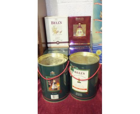 A collection of eight Bell's Old Scotch Whisky decanters: Christmas 1988, 1989, both in drum containers, 1993/96/97/98/99 and