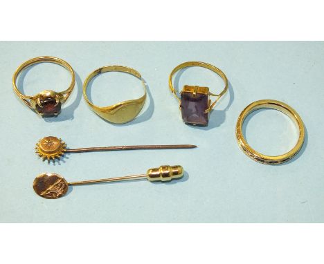 An 18ct gold signet ring, (split), size O, 3g, two other gold rings, both a/f, a small gold stick pin set diamond point and o