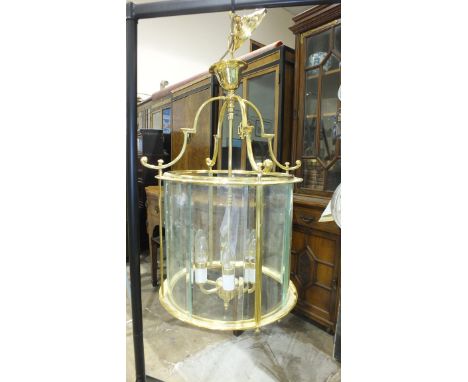 A large modern hanging electric light lantern, of cylinder shape, 63cm high.