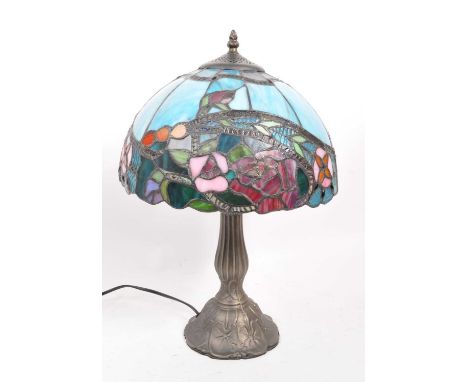 A 20th Century vintage Tiffany style table lamp light. The shade of domed form with floral Art Nouveau style design in blues,