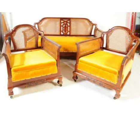 An early 20th century circa 1930s bergere walnet caned living room suite. Comprising of a two seater sofa / settee with a mat