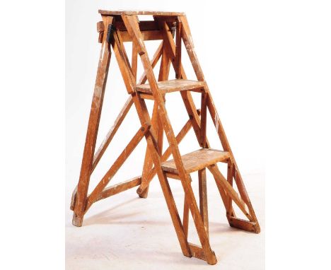 An early 20th century painters folding step ladder. The ladder having folding frame, with a series of three steps / rungs to 