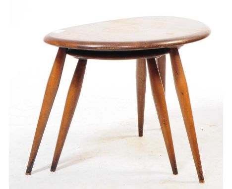 Ercol - Two mid 20th century circa 1960s Ercol dark beech and elm pebble tables. Each having shaped table tops raised over sp