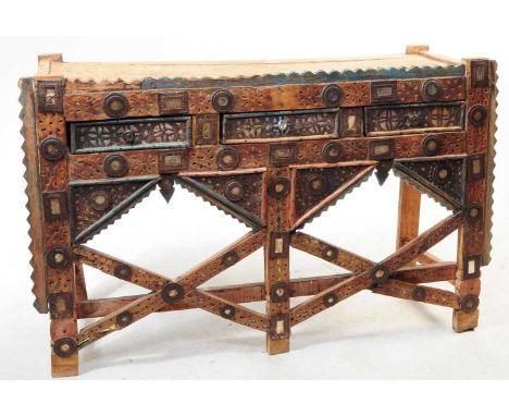 A vintage 20th century Indian carved hall / console table in Rajasthani style. Rectangular form with square upright supports,