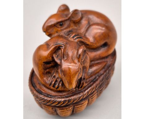 Japanese hand carved boxwood netsuke of Mice within a weaved basket. Both fitted with black bead eyes. Signed. [4cm high] 