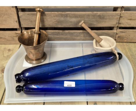 A selection of collectables; 1900s hand blown cobalt blue glass rolling pins, Bronze pestle and mortars and one other. 
