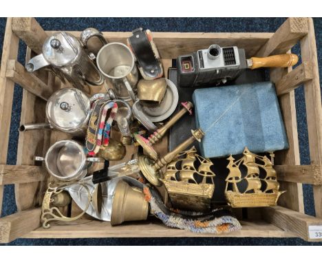 A Crate of silver plate &amp; brass ware; brass cow bells, Brass Galleon bookends, Bell &amp; Howell cine camera, silver plat