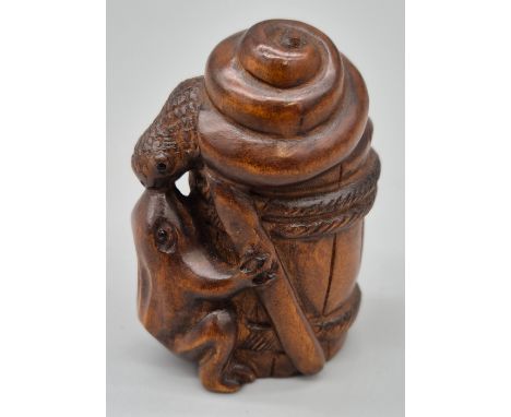 Japanese hand carved boxwood netsuke of a snail, frog and barrel. Both having black bead eyes. Signed. [5.5cm high] 
