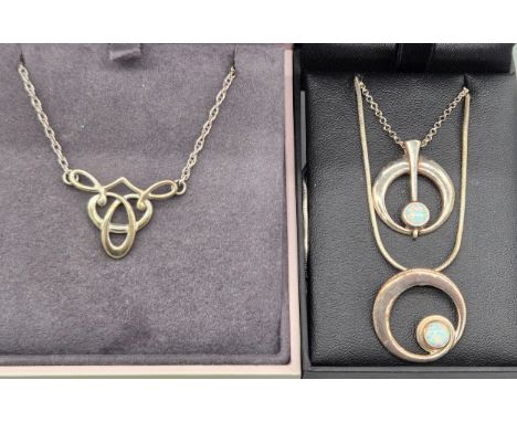 Three various silver pendants and chains; Ola Gorie Scottish Celtic design pendant and chain, Two Ortak silver and opal penda