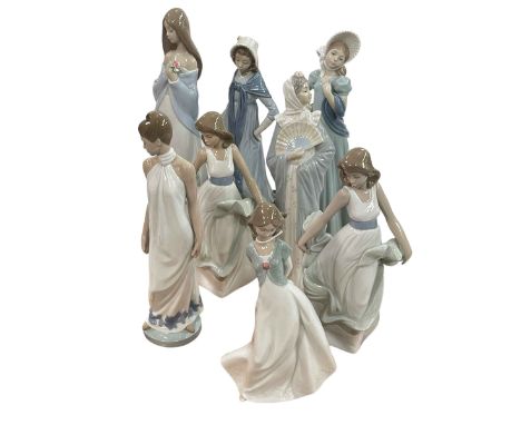 Eight large Nao figures including two Ladies with Bonnets, Floral Beauty and Walking on Air.