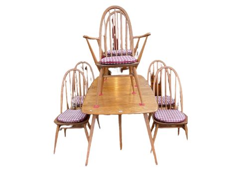 Vintage Ercol elm rectangular extending dining table with integral leaf and six Quaker back dining chairs including pair carv