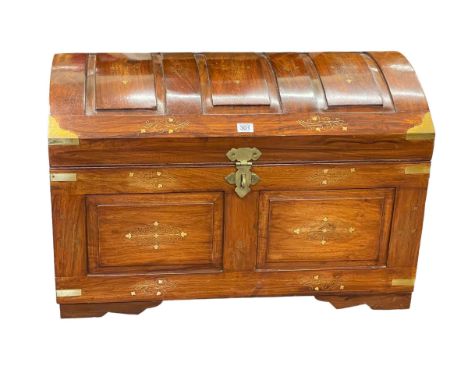 Eastern hardwood and brass inlaid dome top trunk, 49cm by 76cm by 46cm.