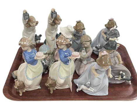 Twelve Nao figures, all with or holding dogs.
