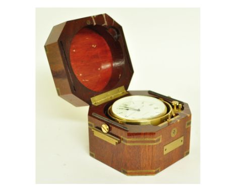 A Baume & Mercier quartz ship's chronometer, in a brass mounted mahogany case, 15 cm wide