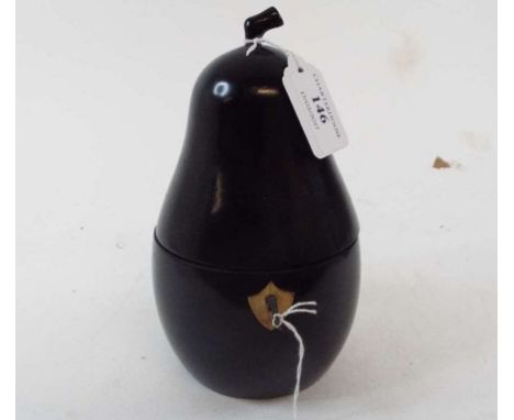 An ebonised tea caddy, in the form of a pear, 18 cm high