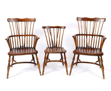 A set of eight elm kitchen stick back armchairs, with crinoline stretchers (6+2) (8)  See illustration