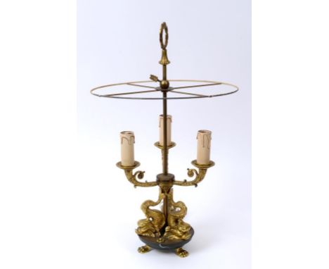 A French style bouilotte style lamp, on dolphin supports, 56 cm high  See illustration