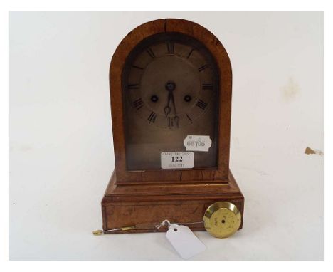 A mantel clock, the silver arched dial with Roman numerals, striking on a bell, in a maple case, 24.5 cm high   Condition rep