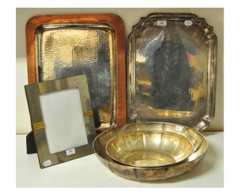 A Christian Dior silver plated bowl, of ribbed form, 43 cm wide, another, two Christian Dior silver plated trays and a photog