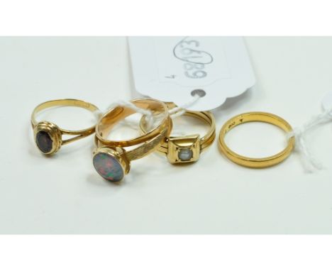 A 22ct gold wedding band, approx. 2.5 g, an 18ct gold and pearl ring, approx. ring size M, and two other rings (4)   Conditio