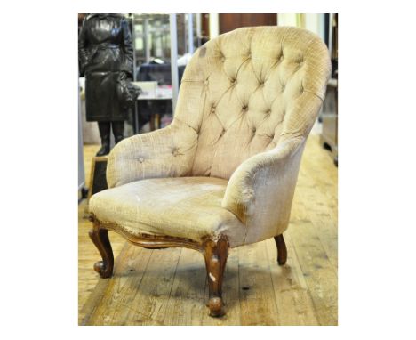 A Victorian walnut button back armchair, on cabriole front legs