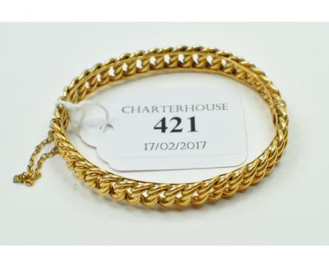 A 10ct gold bangle, with fixed links, approx. 20.1 g