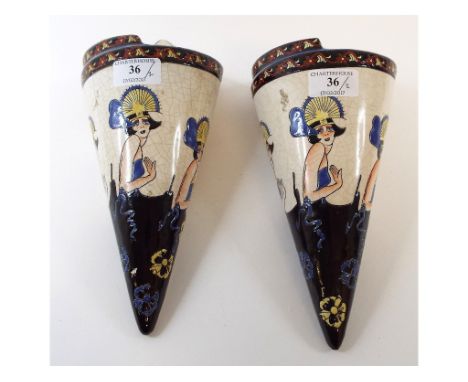 A pair of Art Deco style pottery wall pockets, decorated ladies, 30.5 cm high (2)
