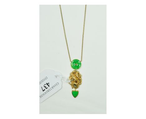 A Chinese yellow coloured metal and jade pendant, on a later 9ct gold chain
