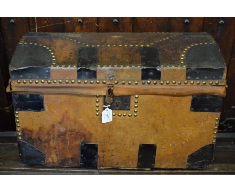 A 19th century dome top leather trunk, with steel mounts and brass studwork decoration, 61 cm wide