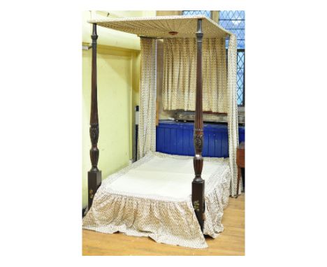 A George III style mahogany four poster bed, the lobed baluster ends decorated fleur de lys and garter motifs, 130 cm wide   