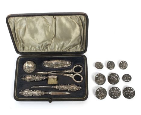 A six piece silver cased ladies manicure set and a set of buttons. The first by maker Adie &amp; Lovkin Ltd, Birmingham 1900,