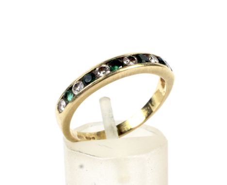 An 18ct gold emerald and diamond half-eternity ring. Alternately set with six round brilliant diamonds (approx. 0.24cts total