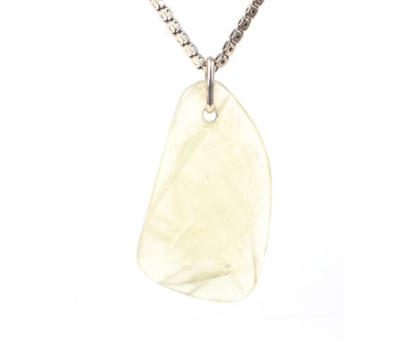 A Victorian gold chain hung with a later light-yellow jadeite pendant. The unmarked yellow gold box-link chain (formerly a gu