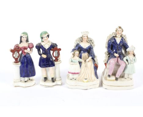 A pair of 19th century Staffordshire pottery figures. Depicting Queen Victoria and Prince Albert with children and a pair of 