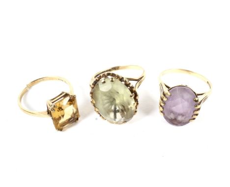 Three vintage 9ct gold single stone dress rings. Comprising a pale-violet oval mixed-cut amethyst ring, claw set between fan-