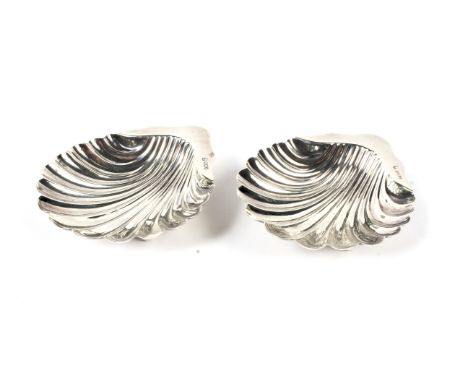 Two silver scallop-shaped butter dishes. Maker James Dixon &amp; Sons, Sheffield 1900, 124.2 grams Condition Report: Both set