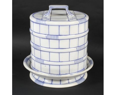 A late 19th century Staffordshire pottery cheese dome. Enriched in blue and moulded as a picnic box, on circular stand, 28cm 