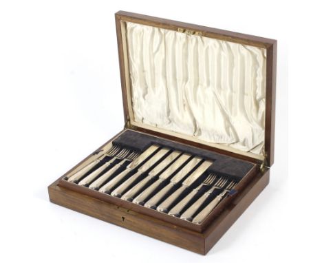 A mahogany cased twelve setting knife and fork salad/dessert set. With lift out tray, Maker Goldsmith and Silversmith Co Ltd,