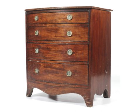 A 19th century mahogany small bow fronted chest of drawers. With four long graduated drawers, fitted with brass ring handles,