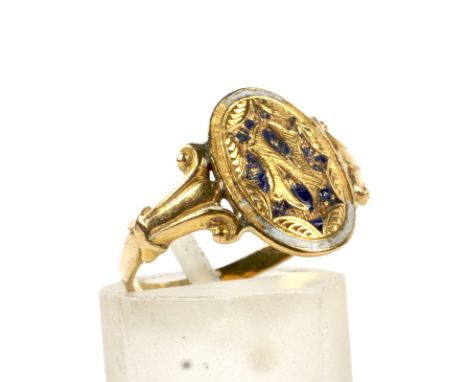 A 19th century gold and enamel oval-panel ring. The head chased with an initial 'N' within a stylised leaf surround and showi