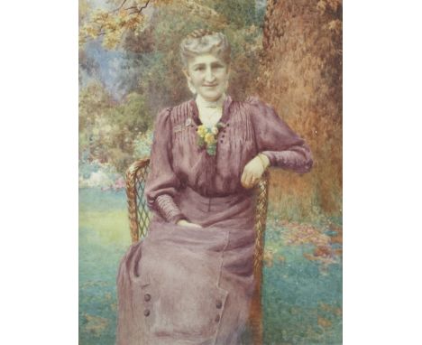 An Edwardian watercolour portrait of a lady. Seated in a garden, within giltwood frame, 43cm x 57cm exc. frame 