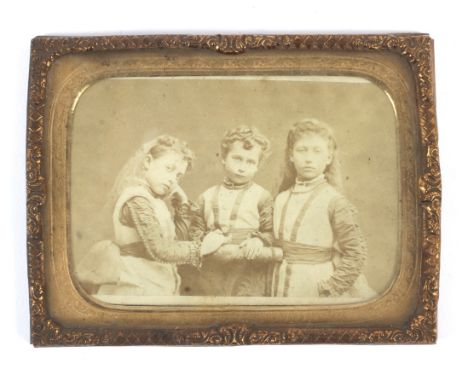 A gilt-metal framed 19th century photograph of the Royal family. Comprising a group portrait of the daughters of Edward VII: 