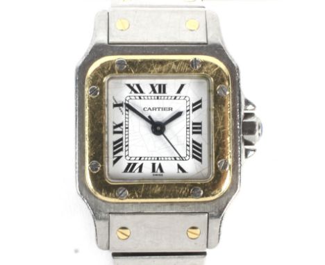 A vintage ladies Cartier Santos stainless steel and gold wristwatch. The squared enamel dial with Roman numerals denoting hou