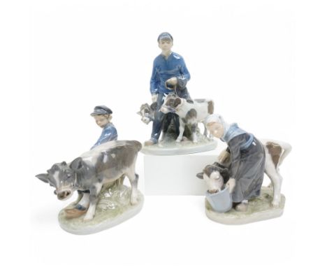 Three Royal Copenhagen figures, including Boy leading two Calves no. 1858, Boy with Calf no. 772, and Girl feeding Calf no. 7