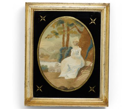 19th century oval woolwork picture of a girl in a garden landscape in verre eglomise frame 45cm x 34cm 
