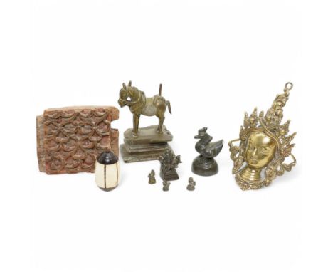 Group of six Burmese bronze opium weights, largest H6.5cm, Nepalese brass deity, Indian bronze horse H12cm, Indian carved pan