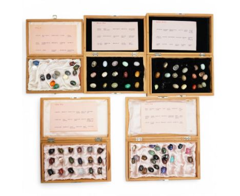 Collection of approx ninety named semi precious stone eggs in five Dunhill cigar boxes 
