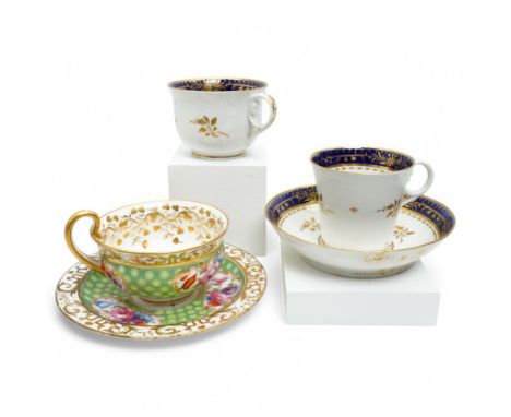  19th century Coalport Felt Spar porcelain cup and saucer painted with panels of flowers on a green and gilt ground and marke
