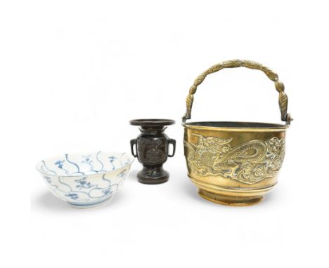 Chinese 20th century polished bronze rice pot with swing handle and raised pattern of dragons D18cm, Meiji period Japanese br